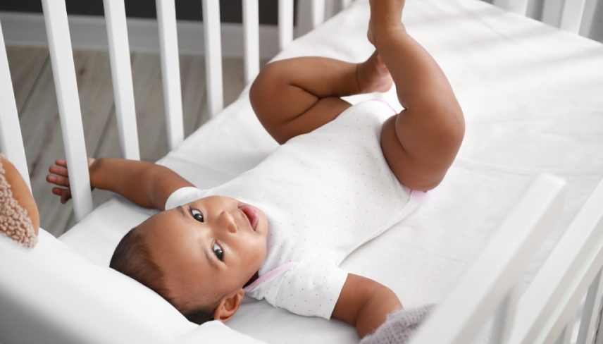 Cute Little Baby in Crib