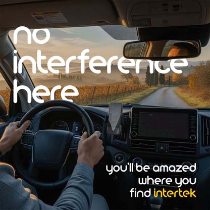 Interior view of car with mounted smartphone driving on a rural road