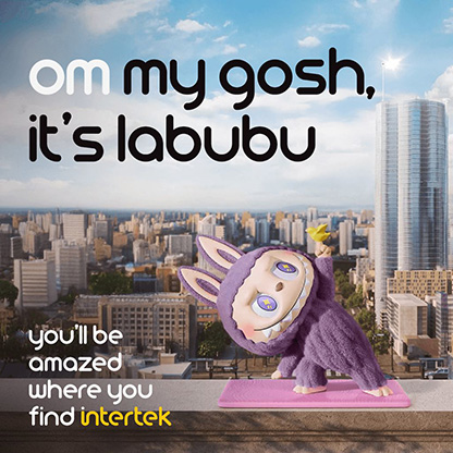 A Labubu toy doing performing exercises in front of a city skyline